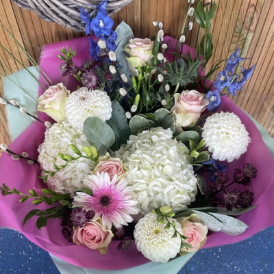 Sweet Escape - A wonderful handtied bouquet in water presented in a gift box/bag. Created using white, pale pink and blue flowers with complimentary foliage. Hand delivered with care in and around Newcastle by Fantasia Florist.